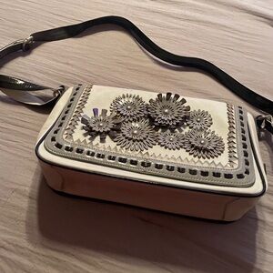 Purse used 1 time, little scuff on the top left but very minor.